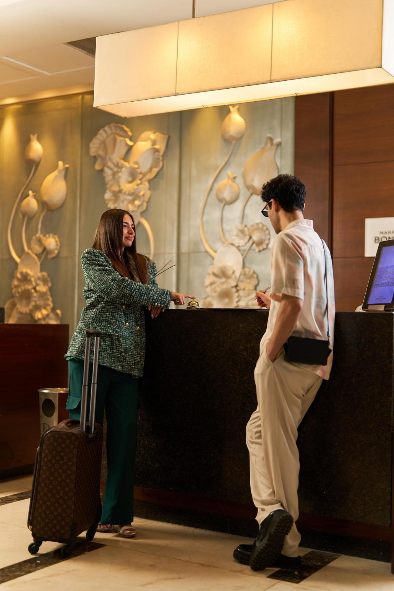 Renaissance Cairo Mirage City Hotel Екстериор снимка A hotel receptionist